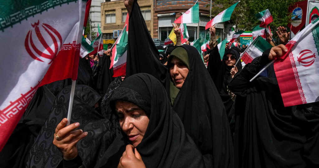 httpsmedia-cldnry.s-nbcnews.comimageuploadt_nbcnews-fp-1200-630f_autoq_autobestrockcms2025-06250612-tehran-iran-protest-flag-ew-537p-53b5a4.jpg