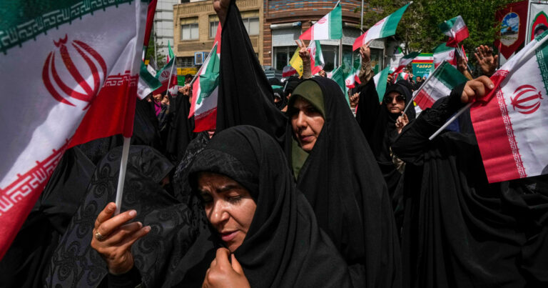httpsmedia-cldnry.s-nbcnews.comimageuploadt_nbcnews-fp-1200-630f_autoq_autobestrockcms2025-06250612-tehran-iran-protest-flag-ew-537p-53b5a4.jpg