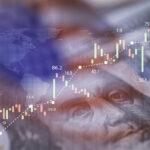 Closeup Benjamin Franklin face on USD banknote with stock market chart graph and American flag for currency exchange and global trade forex concept.