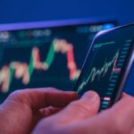 1767663740-Close-Up-Hands-Holding-Smartphone-Stock-