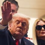 U.S. President Donald Trump attends the College Football Playoff National Championship game at Hard Rock Stadium