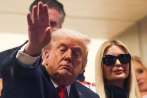 U.S. President Donald Trump attends the College Football Playoff National Championship game at Hard Rock Stadium